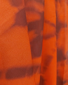 Close-up of orange scarf details