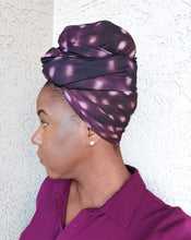 Load image into Gallery viewer, Side profile of model with purple spotted scarf tied around her head.